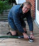 Deck building 23 -Frank using kneepads when sanding the deck -small.JPG