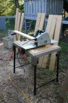 Log building kit new parts at camp 04 -Cutting board to length -small.JPG