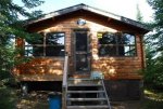 Sanding then re-staining east side of cabin -1 -small.JPG