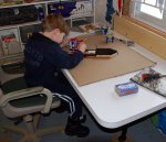 Ethan painting the boat that he made small.JPG