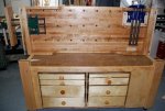 Woodworking bench 58 -Bench top resting on it's side underside forward on the cabinet top -small.JPG