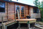 Touching up the preservative on the north wall of the cabin 06 -The first coat of preservative i.JPG