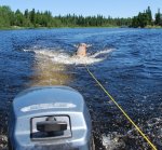 Totem carved at Pellow's Camp 03 -Log for totem being towed behind boat -small.JPG