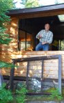 French doors for cabin 12 -Jeff enjoying a coffee after the window frame has been removed -small.JPG