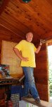 French doors for cabin 18 -Jeff using handsaw to cut up to the kerf in the log that used to be a.JPG