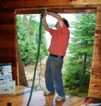 French doors for cabin 19 -Frank cleaning up the cut in the log above the window with a Festool .JPG