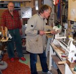 Turning yo-yos 05 -Frank rounding a walnut side with Mack looking on -small.JPG