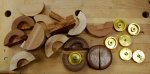 Turning yo-yos 10 -The sides were split apart in order to extract the brass hubs -small.JPG