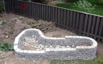 Raised herb garden wall 09 -wall completed and bottom filled with rubble (05-09) -small.JPG