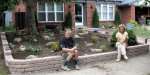 Frank and Susan relaxing after planting garden (06-06) -small.JPG